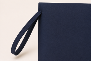 Close-up of the stitched wrist strap attached to the side of the Security Zipper Bag with ID Window.