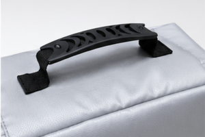Close-up of the stitched top carry handle on the Fireproof & Waterproof Security Bag.